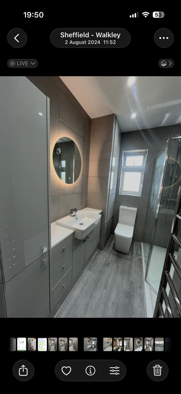 Grey fitted bathroom furniture and enclosed shower — completed DDI bathroom